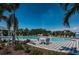 Inviting community pool surrounded by lush landscaping and seating, ideal for relaxation and socializing at 12315 Dora Trail, Parrish, FL 34219