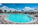 Expansive community pool featuring ample seating and clear blue water, perfect for relaxation and recreation at 12315 Dora Trail, Parrish, FL 34219