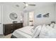 Bedroom featuring a queen bed, carpeted floors, and a dark wood dresser at 12409 Gentle Swan Pl, Odessa, FL 33556
