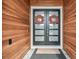 Inviting entrance featuring double doors with modern glass panes and a welcoming doormat at 12409 Gentle Swan Pl, Odessa, FL 33556