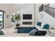 Bright living room with fireplace and a large TV and views to the outdoor living area at 12409 Gentle Swan Pl, Odessa, FL 33556