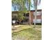 Two-story brick building with stairs, balconies, and well-maintained landscaping at 1257 Drew St # 8, Clearwater, FL 33755