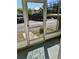 Enclosed porch reflecting nearby parking and stairwell at 1257 Drew St # 8, Clearwater, FL 33755