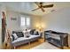 This Bedroom includes a cozy sofa, decorative pillows, and a crib for a welcoming space at 1655 Owen Dr, Clearwater, FL 33759