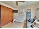 The room has a mounted TV, a sofa, a wardrobe, and a window for a cozy space at 1655 Owen Dr, Clearwater, FL 33759