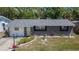 Beautiful home showcasing a well maintained front lawn and a welcoming entrance at 1655 Owen Dr, Clearwater, FL 33759