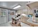 Bright kitchen with light wood cabinets, neutral countertops, and stainless steel appliances at 1655 Owen Dr, Clearwater, FL 33759