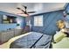 Serene main bedroom with navy blue accent wall, shuttered window, and contemporary décor at 1655 Owen Dr, Clearwater, FL 33759