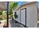 Exterior view of the shed showcasing its siding and outdoor plants at 1655 Owen Dr, Clearwater, FL 33759
