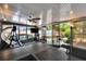 Enclosed sunroom, equipped with a ceiling fan, tv, swing and dining area for outdoor entertaining at 1655 Owen Dr, Clearwater, FL 33759