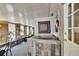 View of the sunroom bar, with a decorative accent wall and access to the backyard at 1655 Owen Dr, Clearwater, FL 33759