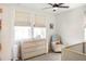 Bright Bedroom with natural light, a changing table, and a comfortable armchair at 1725 Massachusetts Ne Ave, St Petersburg, FL 33703