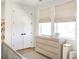 Bright Bedroom with natural light, a changing table, and ample storage at 1725 Massachusetts Ne Ave, St Petersburg, FL 33703