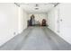 Spacious garage with epoxy flooring and storage cabinets provides ample space for vehicles and tools at 1725 Massachusetts Ne Ave, St Petersburg, FL 33703