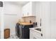 Well-equipped laundry room with front loading washer/dryer and ample storage space with modern design at 1725 Massachusetts Ne Ave, St Petersburg, FL 33703