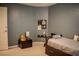 Cozy bedroom features neutral carpet, gray walls, and a neatly made bed at 18919 Place Marquette, Lutz, FL 33558