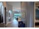Elegant hallway with stylish decor, arched doorways, and wood-look tile flooring at 18919 Place Marquette, Lutz, FL 33558