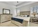 Bedroom with neutral walls, carpeted flooring, a ceiling fan, and tray ceilings at 19624 Lonesome Pine Dr, Land O Lakes, FL 34638