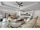 Open living area with tile flooring, lots of seating, a ceiling fan, and an open-concept kitchen at 19624 Lonesome Pine Dr, Land O Lakes, FL 34638