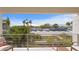Balcony view features beach, palm trees and ocean beyond at 2003 Gulf Way, St Pete Beach, FL 33706