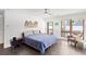 Bright, airy bedroom featuring a large window, comfortable bed, and modern decor at 2003 Gulf Way, St Pete Beach, FL 33706