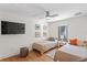 Bright bedroom with two twin beds, modern decor, and a large flat-screen TV at 2003 Gulf Way, St Pete Beach, FL 33706