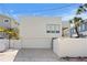 Modern home exterior featuring a two-car garage and clean architectural lines at 2003 Gulf Way, St Pete Beach, FL 33706