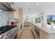 Gourmet kitchen with stainless steel appliances and light colored cabinets at 2003 Gulf Way, St Pete Beach, FL 33706