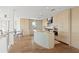 Modern kitchen featuring custom cabinets, a spacious island, and stainless steel appliances at 2003 Gulf Way, St Pete Beach, FL 33706