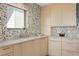 Kitchen features stone countertops, tile backsplash, and stainless steel appliances at 2003 Gulf Way, St Pete Beach, FL 33706