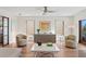 Living room featuring hardwood floors, neutral decor, and large windows at 2003 Gulf Way, St Pete Beach, FL 33706