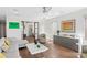 Open living room features modern decor and access to laundry and office at 2003 Gulf Way, St Pete Beach, FL 33706