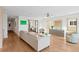 Bright living room with hardwood floors, modern decor, and lots of natural light at 2003 Gulf Way, St Pete Beach, FL 33706