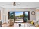 Bright living room with hardwood floors and sliding glass doors leading to ocean views at 2003 Gulf Way, St Pete Beach, FL 33706