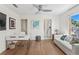 Cozy home office featuring hardwood floors, a desk and access to laundry at 2003 Gulf Way, St Pete Beach, FL 33706