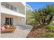 The outdoor patio has lounge chairs, lush landscaping, and coastal breezes at 2003 Gulf Way, St Pete Beach, FL 33706