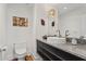 Elegant powder room with unique light fixture, modern vanity, and stylish decor at 2003 Gulf Way, St Pete Beach, FL 33706