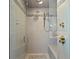 Modern glass shower with stone accents and a rainfall showerhead at 2003 Gulf Way, St Pete Beach, FL 33706