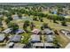 Aerial view of the property showcasing its location within a lush, green community with ponds at 2202 Clubhouse Dr # 174, Sun City Center, FL 33573