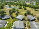 Aerial view of the property showcasing its location within a lush, green community with ponds at 2202 Clubhouse Dr # 174, Sun City Center, FL 33573