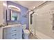 Updated bathroom with white vanity, a framed mirror, and a glass-enclosed shower at 2202 Clubhouse Dr # 174, Sun City Center, FL 33573