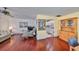 Inviting living room featuring gleaming hardwood floors and an open layout to the kitchen at 2202 Clubhouse Dr # 174, Sun City Center, FL 33573