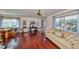 Spacious living room with abundant natural light, hardwood floors, and comfortable seating at 2202 Clubhouse Dr # 174, Sun City Center, FL 33573
