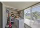 Enclosed porch featuring laundry appliances with bright natural light at 2202 Clubhouse Dr # 174, Sun City Center, FL 33573