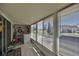 Enclosed porch with laundry appliances and views of the exterior yard at 2202 Clubhouse Dr # 174, Sun City Center, FL 33573