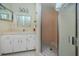 Bathroom featuring vanity, sink, mirror, lighting, and walk-in shower at 2229 Americus W Blvd # 25, Clearwater, FL 33763