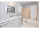 Bathroom featuring a vanity, sink, mirror, toilet, and tub with shower at 2229 Americus W Blvd # 25, Clearwater, FL 33763