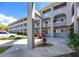 Charming three-story building with arched entryways, landscaped grounds, and ample parking at 2229 Americus W Blvd # 25, Clearwater, FL 33763