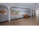 Hallway with a large mural with seating, enhancing the community space at 2229 Americus W Blvd # 25, Clearwater, FL 33763
