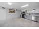 Spacious eat-in kitchen with tile floors, stainless appliances and grey cabinetry at 2229 Americus W Blvd # 25, Clearwater, FL 33763